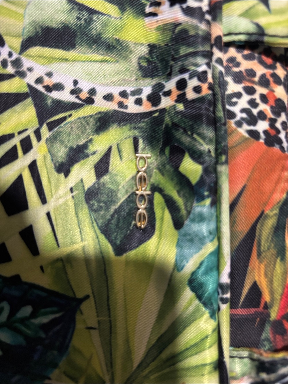 bebe Tropical Leaf & Animal Print lunch bag in Green, Black, Orange.